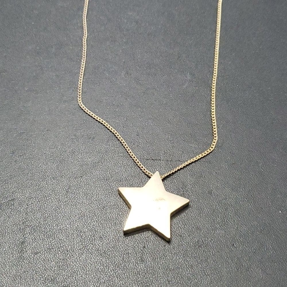 Gold tone star pendant necklace 20-23"